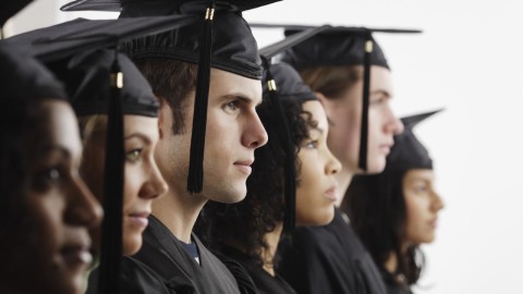 Graduates in Cap and Gown --- Image by © Royalty-Free/Corbis