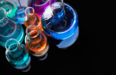 Image of several flasks with multi-color chemical liquids